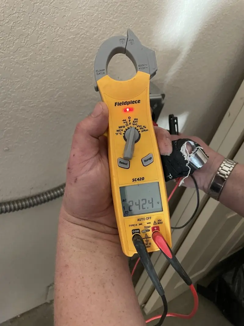 Voltage testing with clamp meter during Ceiling Fan Installation in Hopatcong